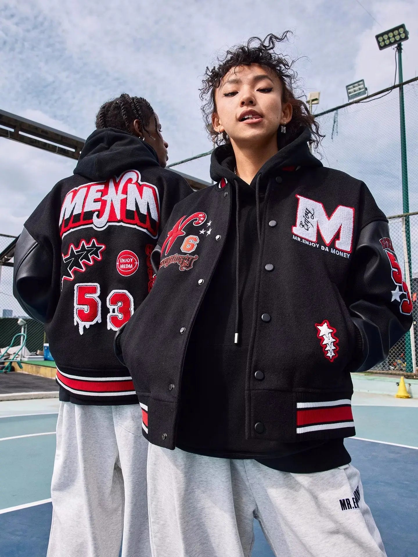 a couple of people standing next to each other 