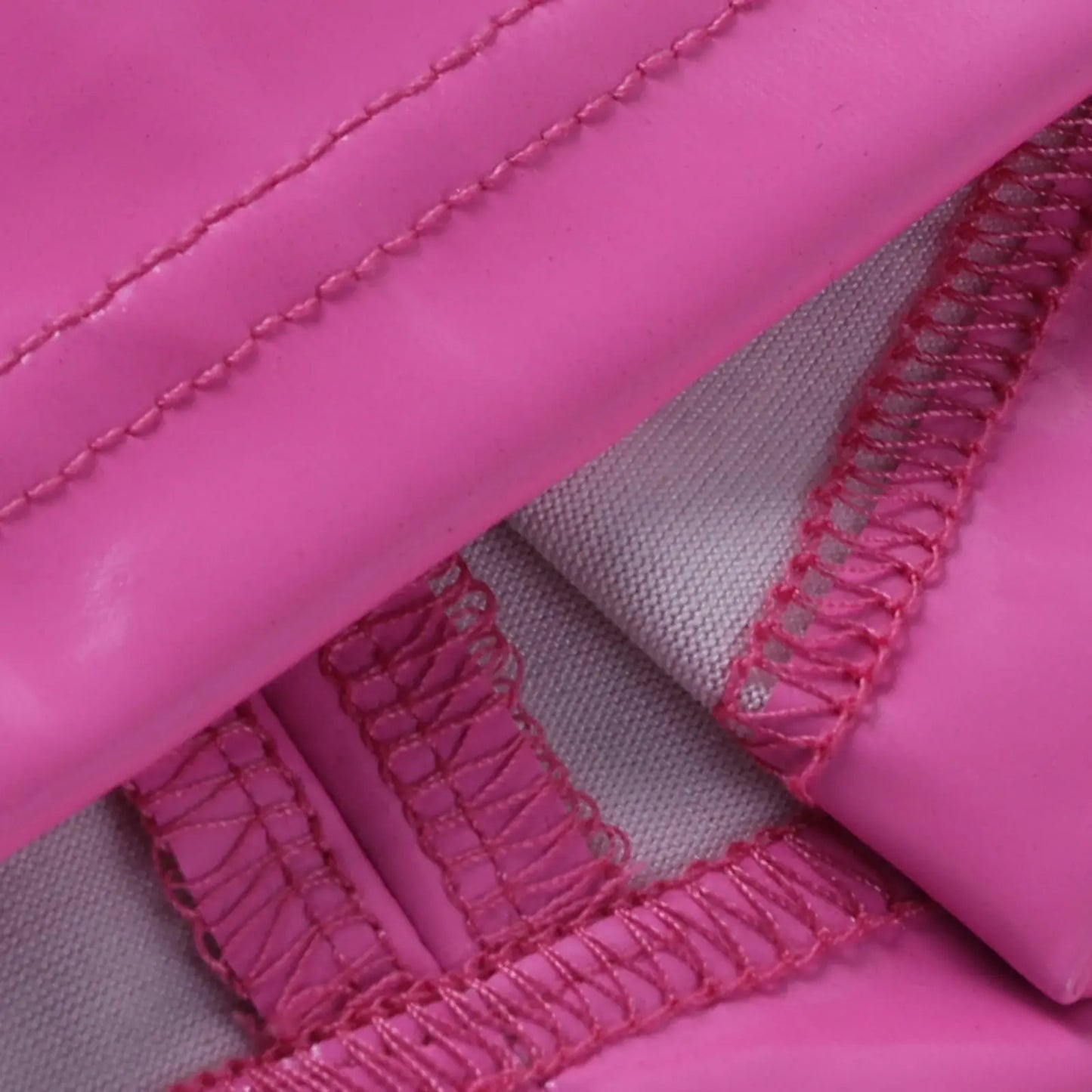 a pink pink and purple pillow on a pink blanket 