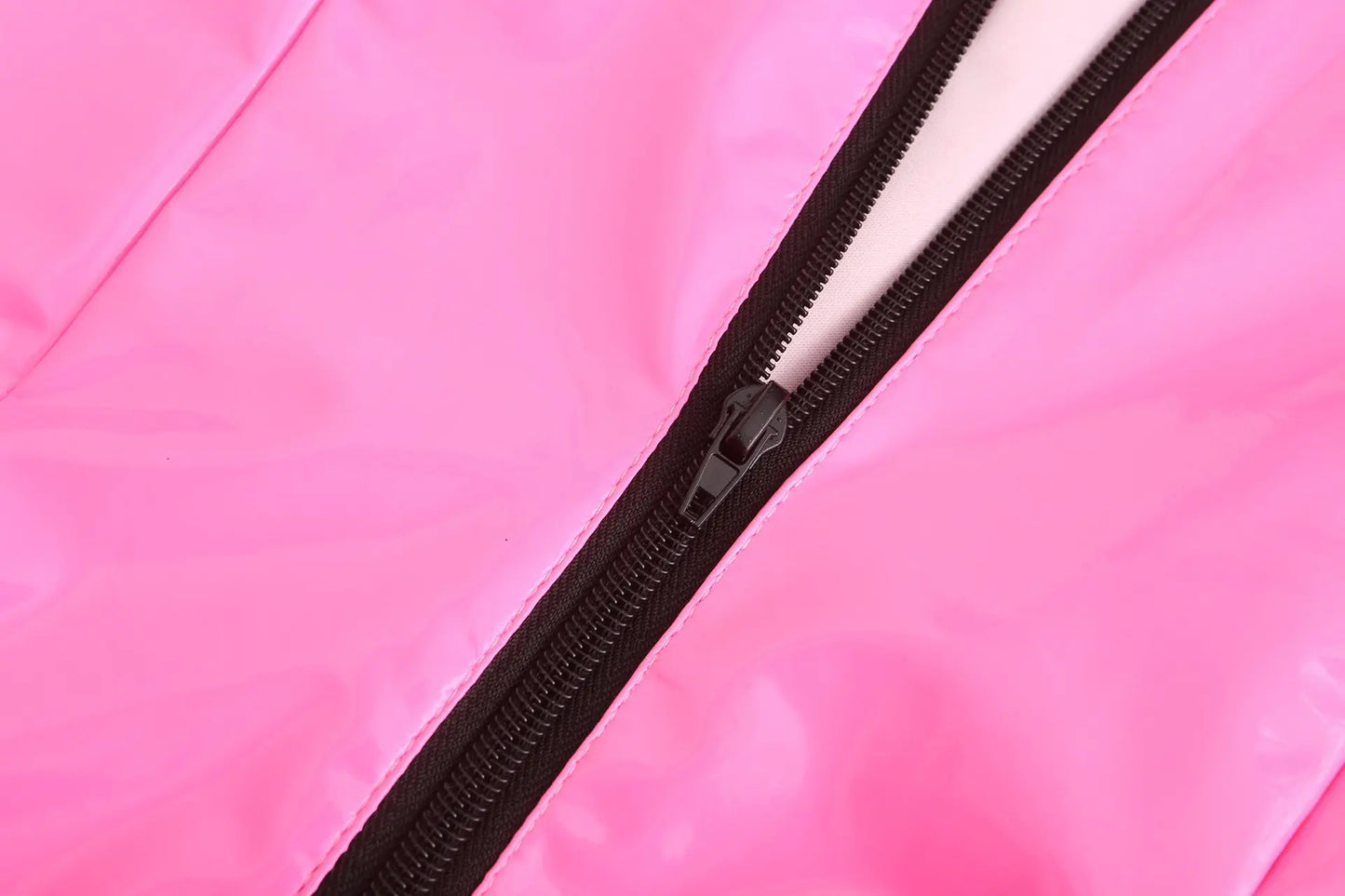 a close up of a knife on a pink surface 