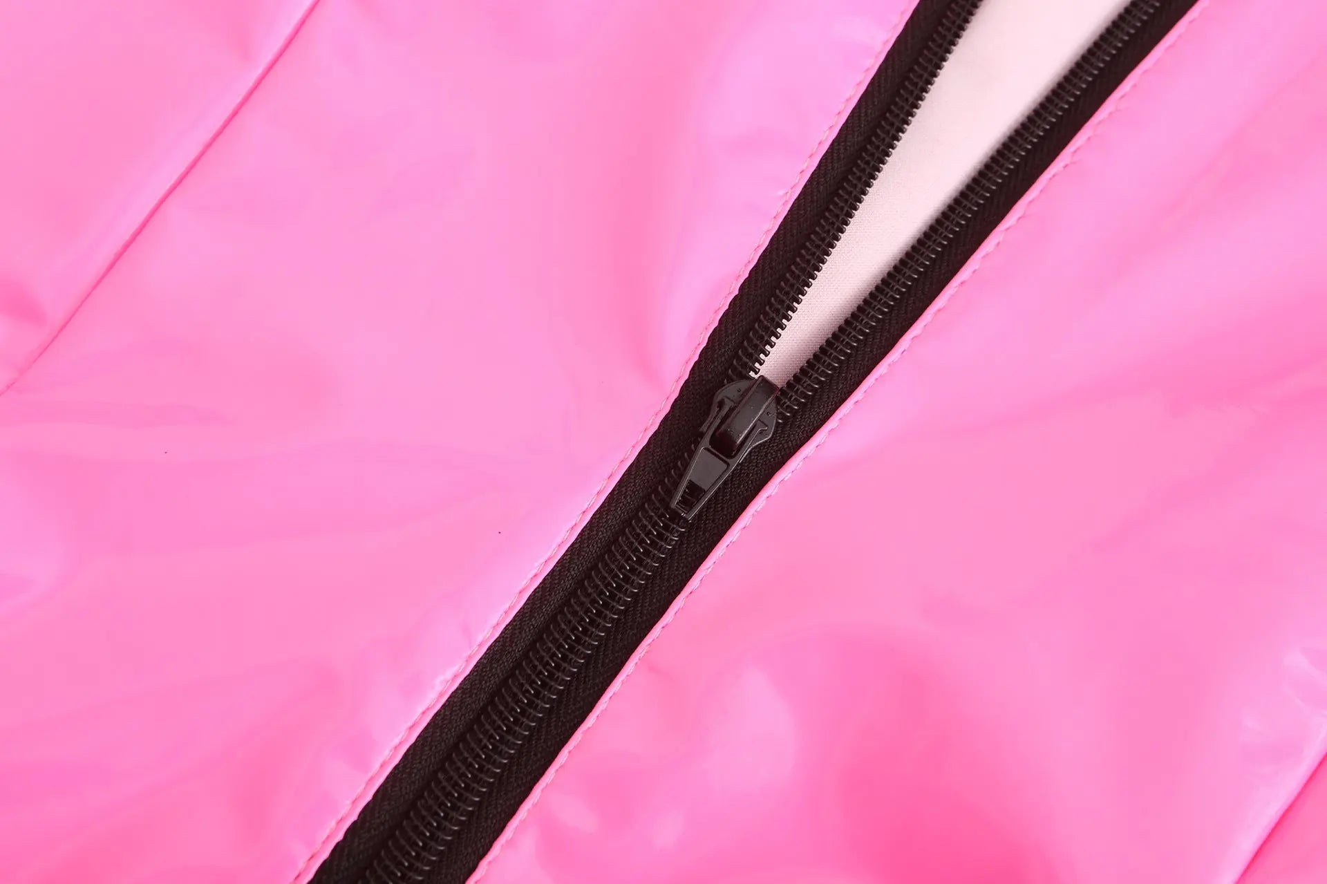a close up of a knife on a pink surface 