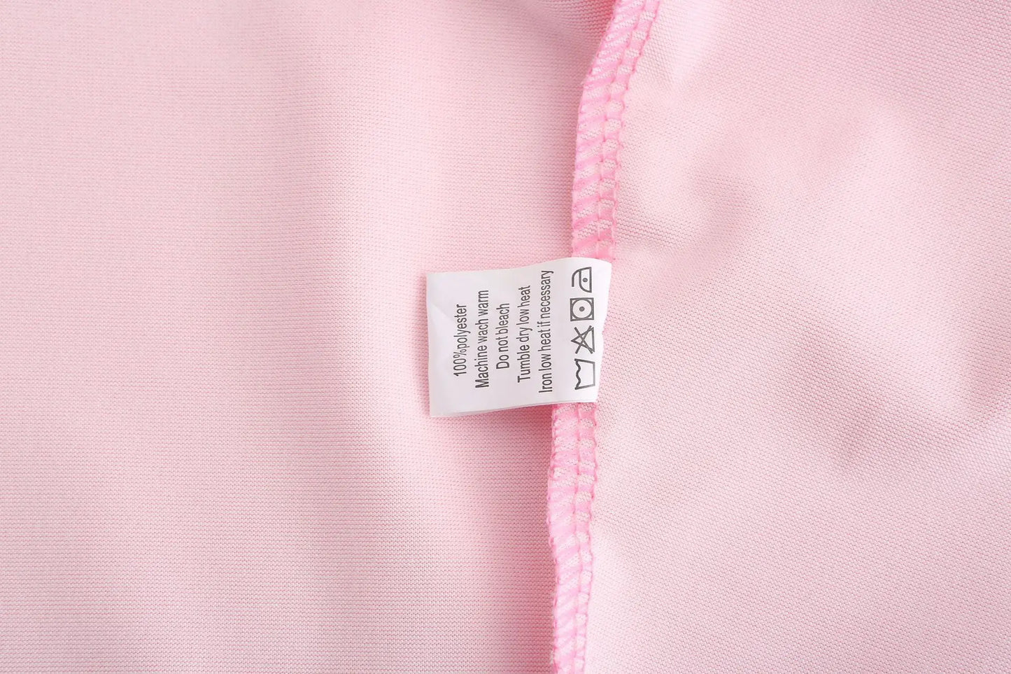 a close up of a pink street sign on a pink pole 