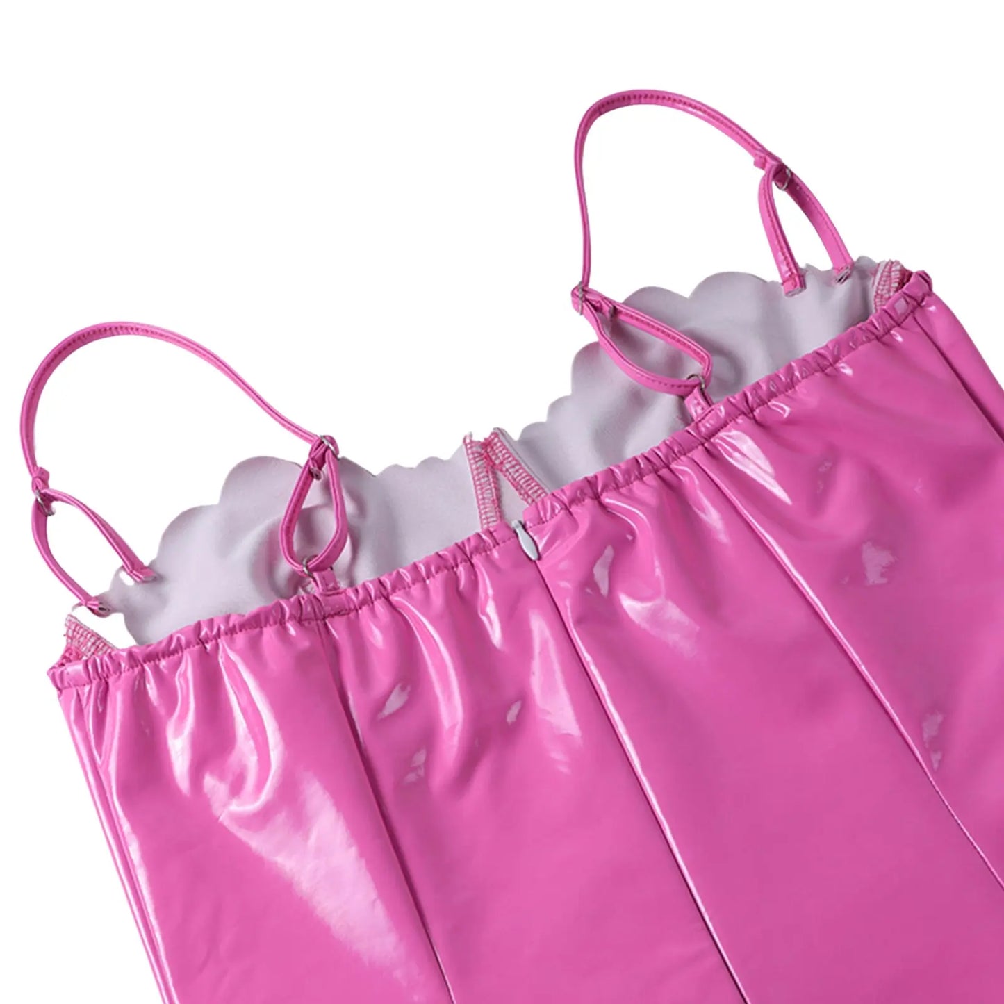 a pink umbrella is laying on a pink blanket 