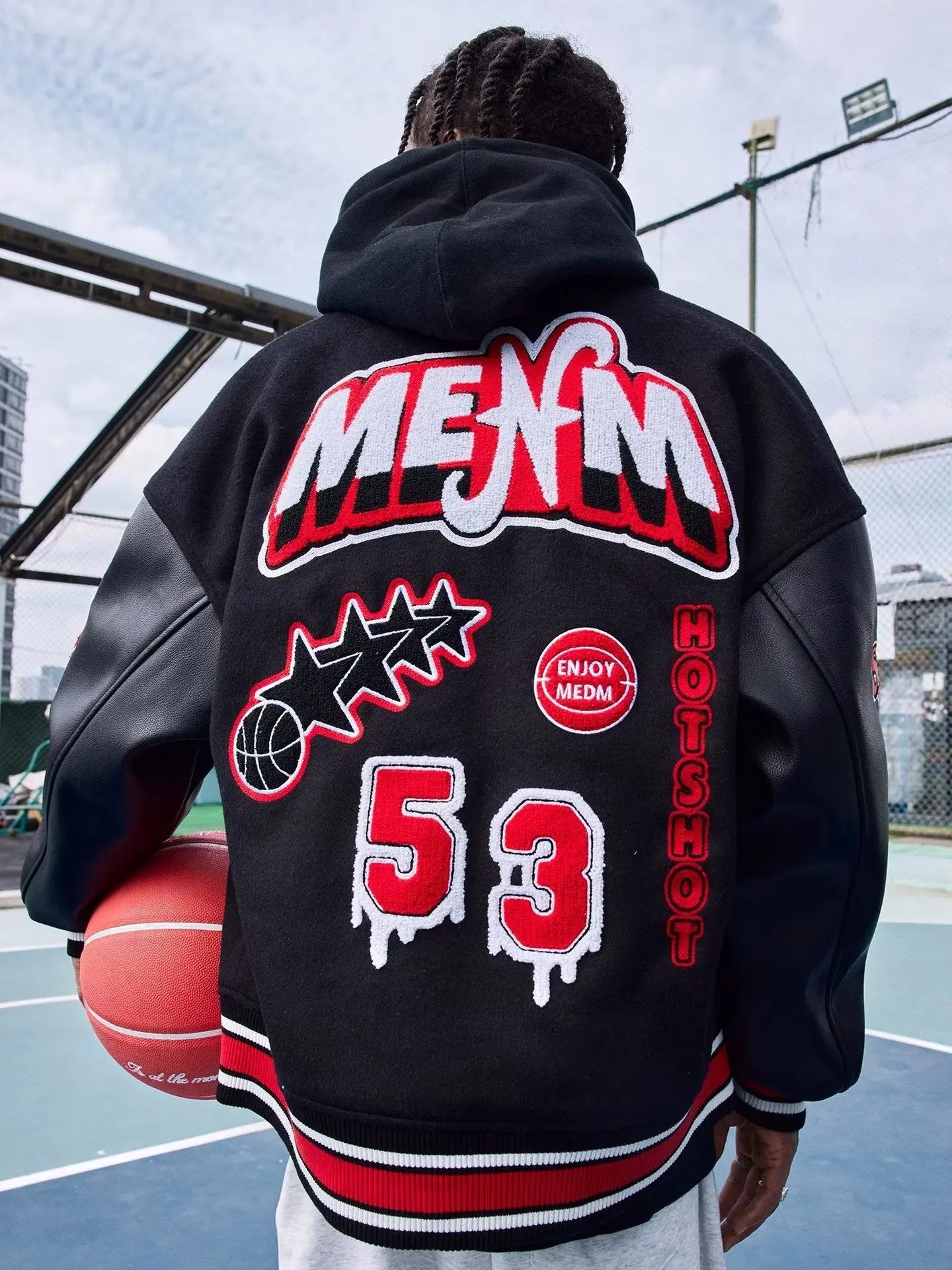 a baseball player is holding a baseball bat 